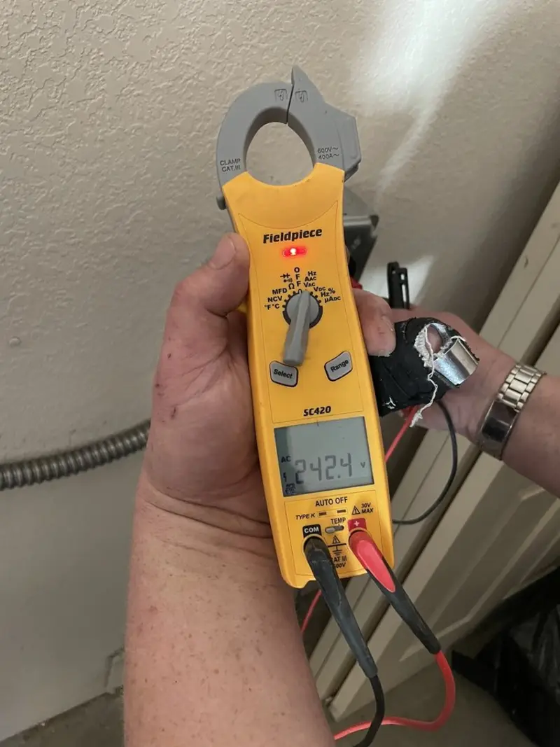 Voltage testing with clamp meter during Generator Installation in Weston